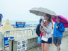 Visitors to the Festival ensure the rain that stayed coming down Saturday evening.