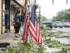 These American flags were salvaged from under glass and limbs and propped up on a parking meter. Many people, still dazed, turned to rescuing the flags in the street immediately afterward.